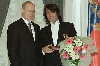 Basjmet (rechts) met Vladimir Poetin, in 2001