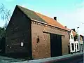 Dorpswoningen met vlasschuur