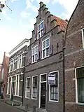 Huis met trapgevel, blijkens gevelsteen