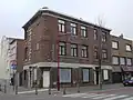 Handels- en appartementsgebouw ontworpen door A. Devreese