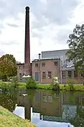 Fabriekscomplex "Koninklijke Euroma". Complexonderdelen (2): Voormalige zuivelfabriek uit 1946, Schoorsteen