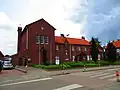 R.K. klooster annex school met kapel en kruisbeeld