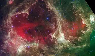 Infraroodopname bij 3,6 (blauw), 8 (groen), en 24 micron (rood) door Spitzer Space Telescope van de Zielnevel en de geassocieerde sterrenhoop IC1848 in de Zielnevel