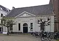 School en hek, kerkelijk centrum Open Hof