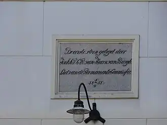 Eerste steen in de muur van de kerk van Wilhelminaoord