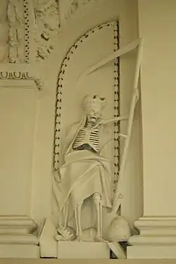 Skelet met een zeis in de St. Peter en St. Paul's kerk, Vilnius