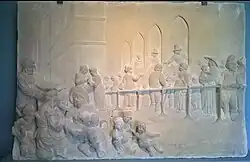 Zandstenen reliëf, Armenhuis