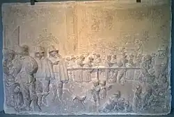 Zandstenen reliëf, Armenhuis